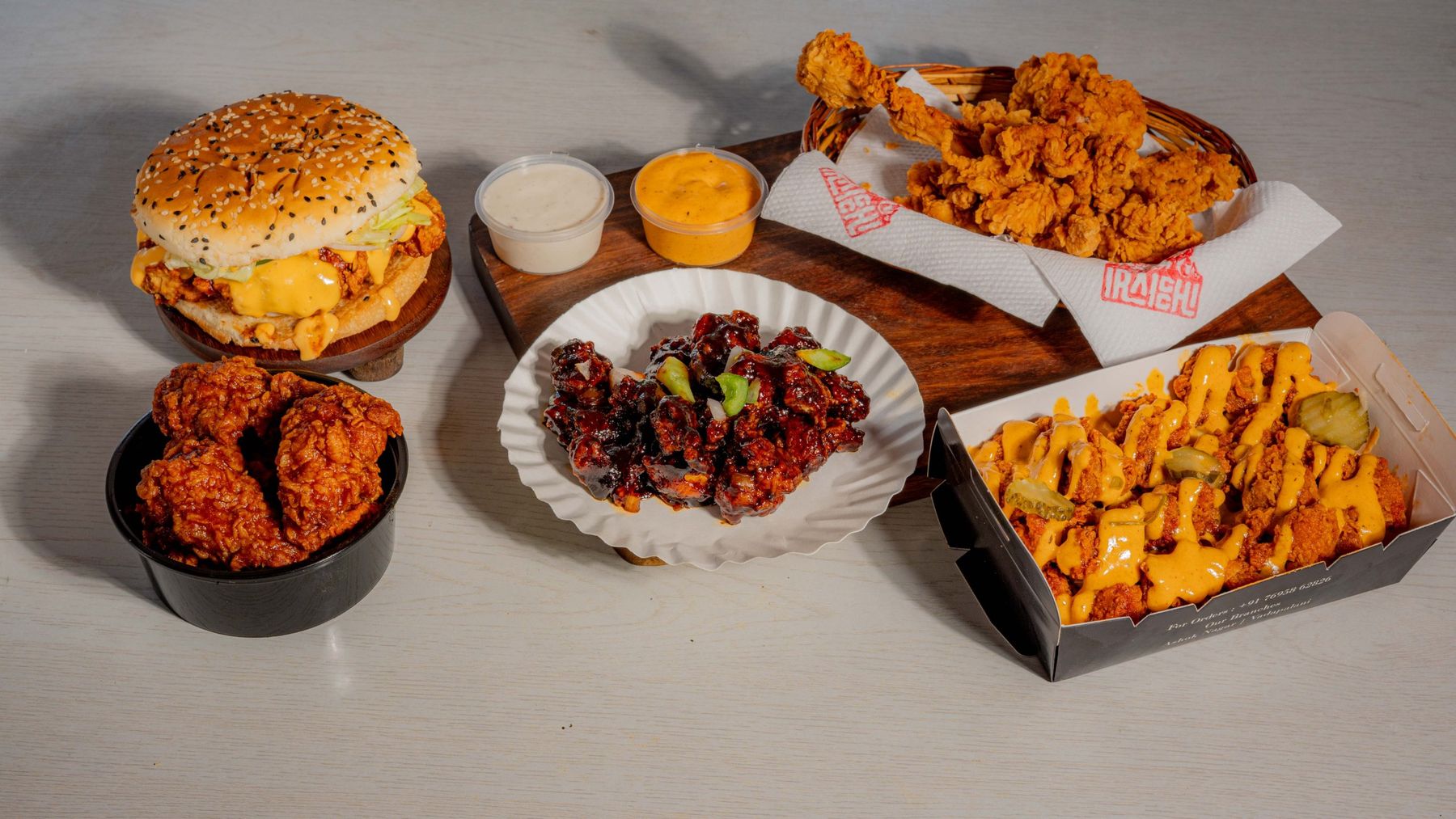 Iraicchi burger, wings, Honey BBQ pops, fried chicken and loaded fries